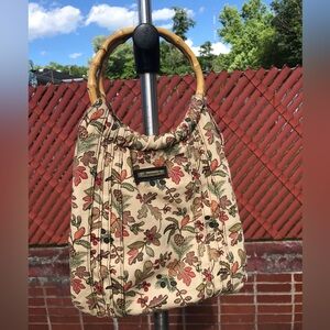 Longaberger purse with wooden handles.  Pretty Fall leaves pattern.